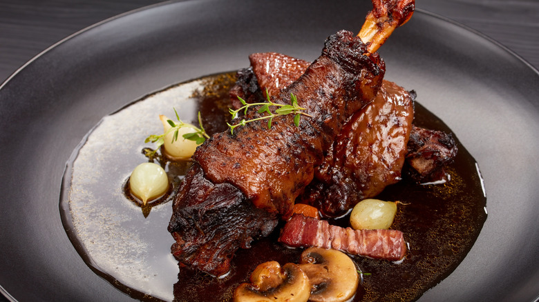 Coq au vin on black plate