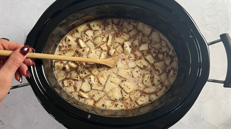 stirring spices into milky oats