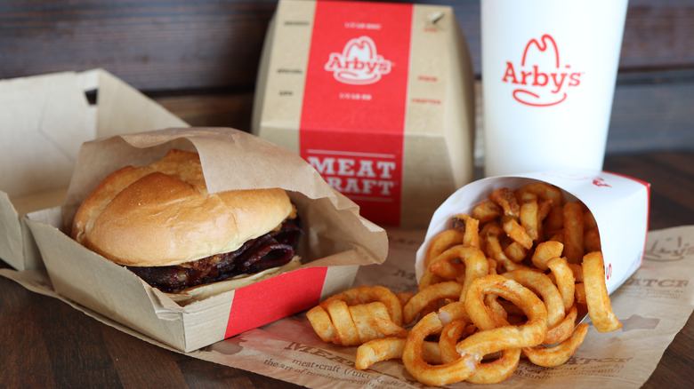 Arby's meal with a burger and curly fries