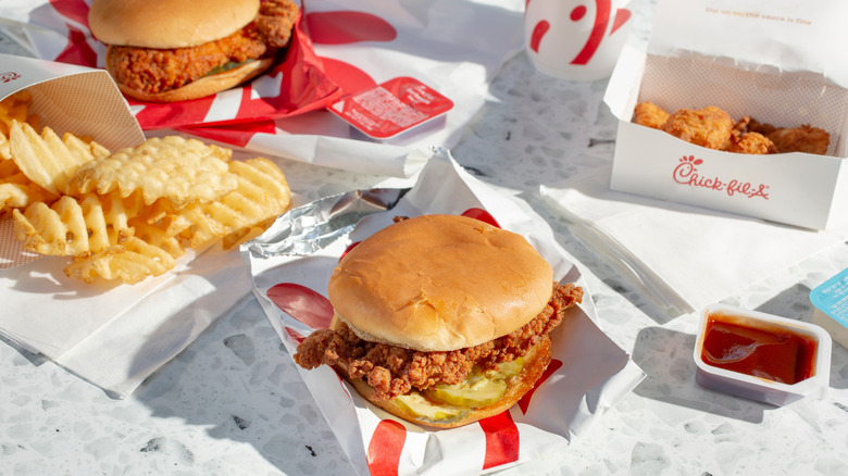 A variety of Chick-fil-A menu items laid out on a table