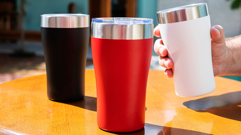Three insulated travel mugs