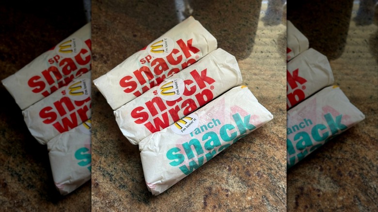Three McDonald's Snack Wraps on granite countertop