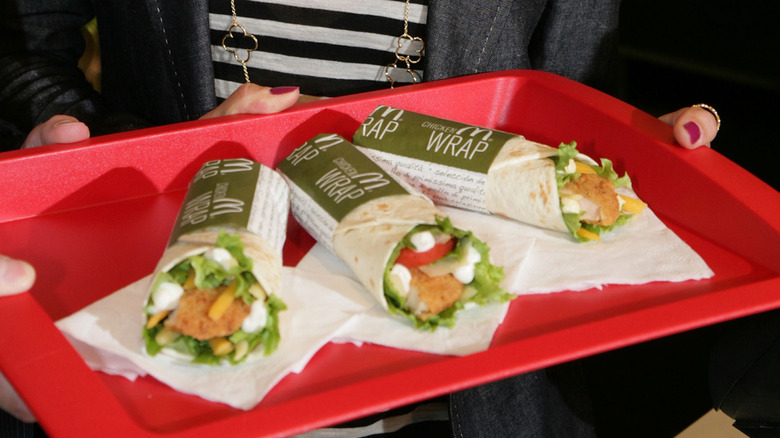 Three McDonald's Snack Wraps on a red platter