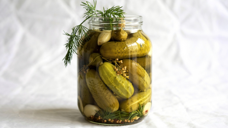 Crisp pickled cucumbers in a jar.