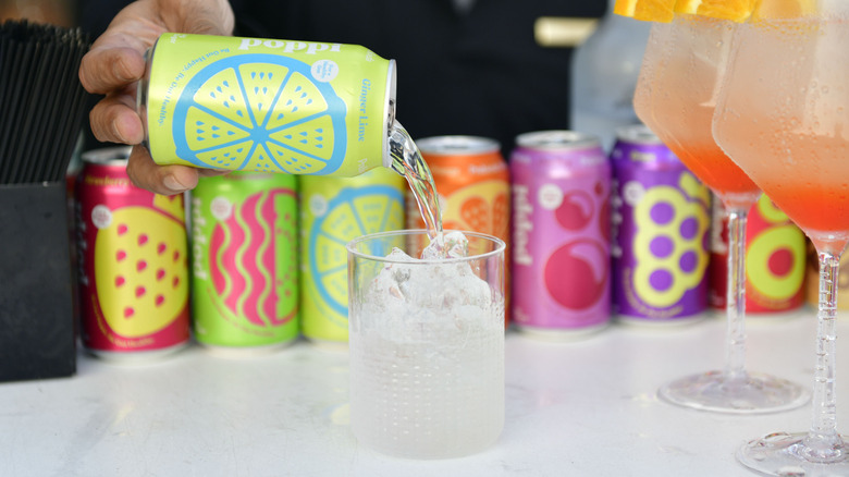 A Poppi soda being poured into a glass