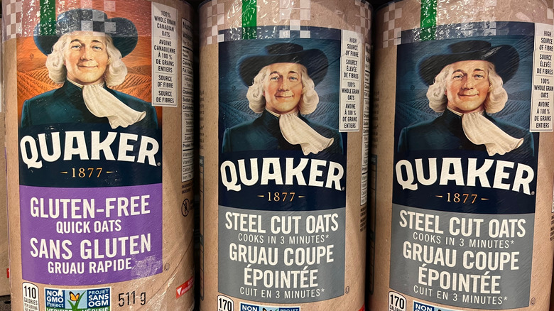 Containers of Quaker Oats on a store shelf