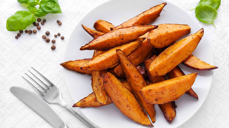 Delicious homemade sweet potato wedges on a plate.