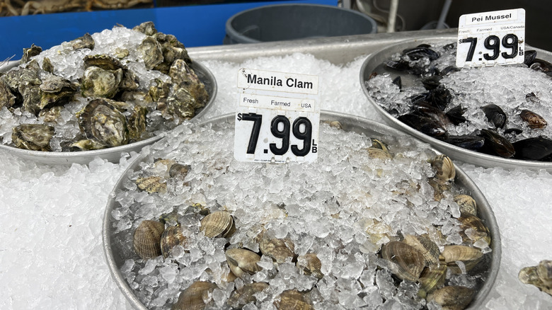 clams sold at market over ice