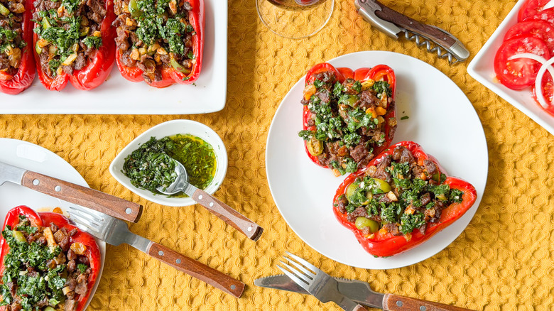 Argentinian picadillo beef-stuffed bell peppers on serving platter and plate