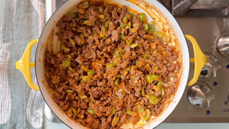 Picadillo beef with sliced green olives and golden raisins