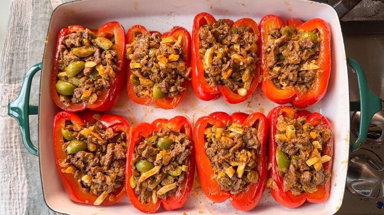 Roasted red bell pepper halves stuffed with picadillo beef