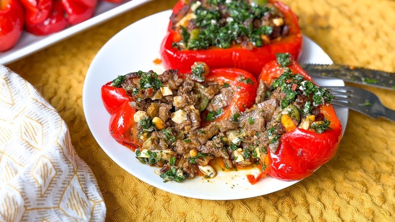 Argentinian picadillo beef-stuffed bell pepper on plate with fork