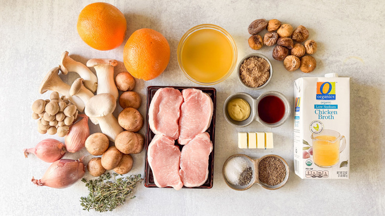 Aromatic smothered pork chops ingredients on countertop