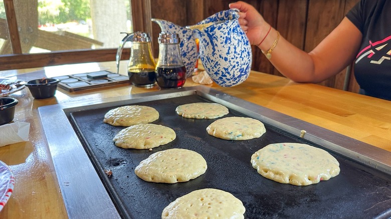 Pancakes on griddle at Old Sugar Mill Pancake House
