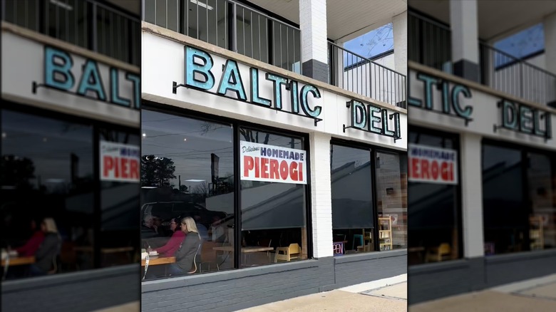 Exterior of Baltic Deli with a sign advertising homemade pierogi