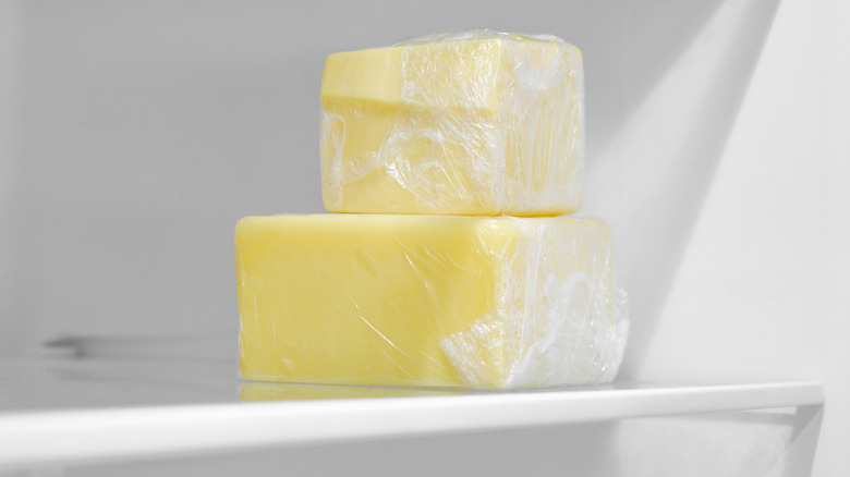 Sticks of butter wrapped in plastic