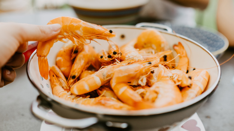 A bowl of pink shrimp.