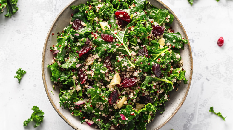 Kale, quinoa, and cranberry salad in a dish