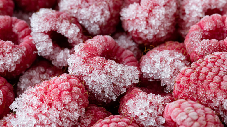 Frozen raspberries with frost build up on them