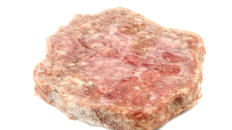 Frozen hamburger patty with freezer burn