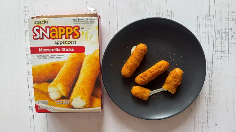Snapps box and mozzarella sticks on a black plate
