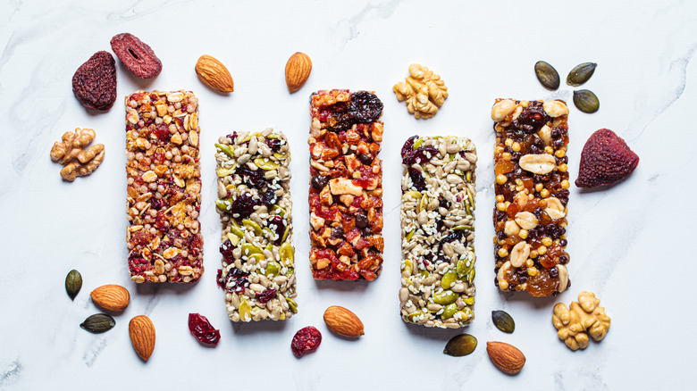 Five different protein bars with dried fruits and nuts
