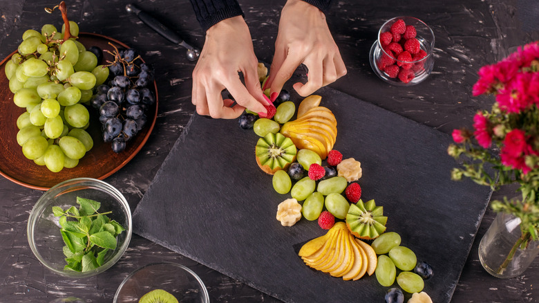 Assembling fruit on a platter