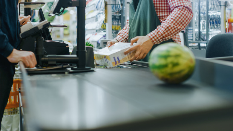 Food items being scanned at a grocery store till
