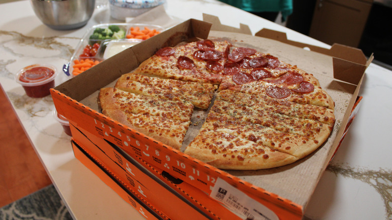 Boxes of Little Caesars pizza on counter