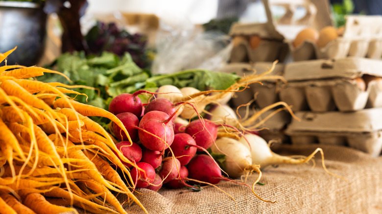 Fresh produce and eggs on display.