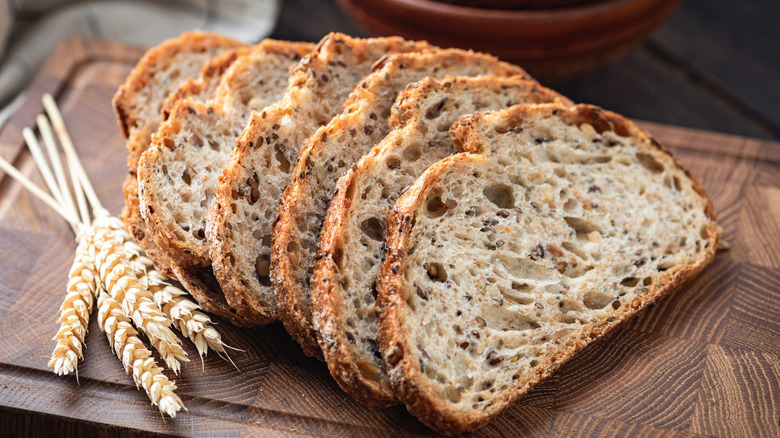 A loaf of whole wheat bread cut into slices