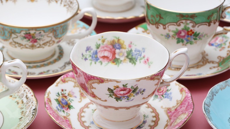 vintage china tea cups with a lacy rose pattern