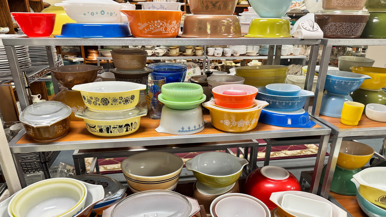 colorful vintage pyrex baking dishes on shelves