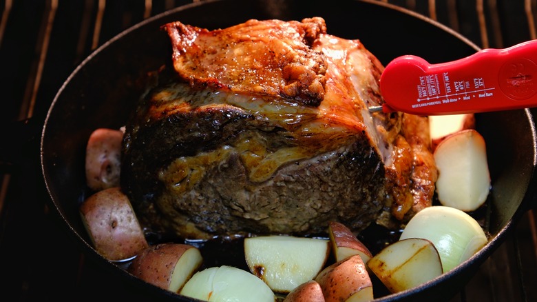 A roast beef with a meat thermometer