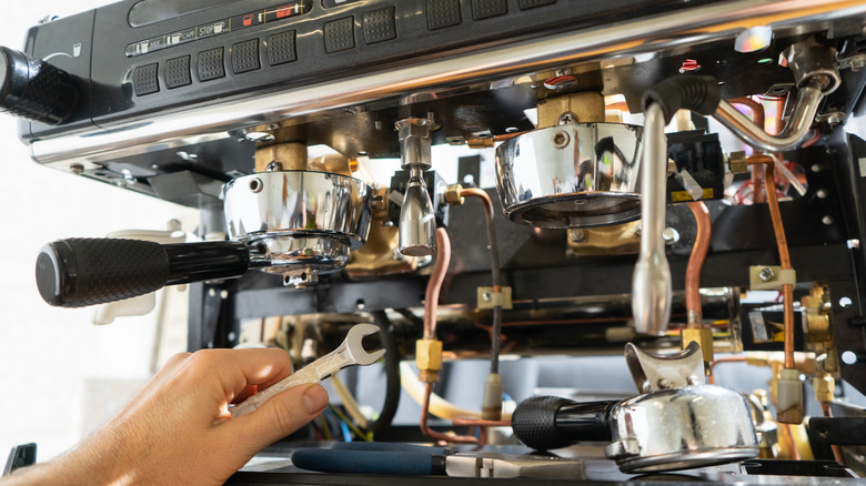 An espresso machine's wires get fixed.
