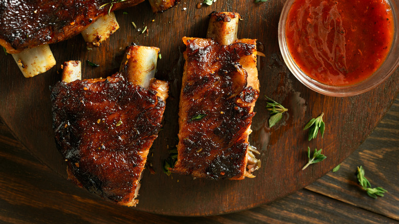 Individual grilled pork ribs are photographed from above.