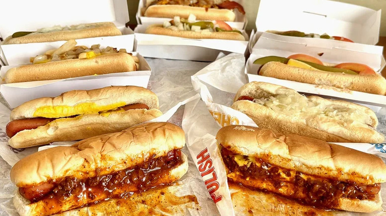 An array of Wienerschnitzel hot dogs lined up next to each other.