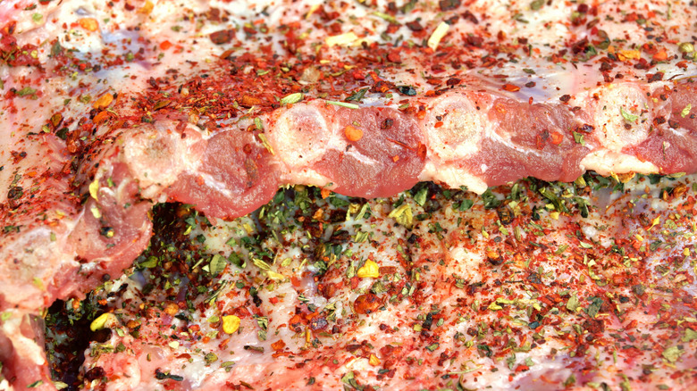 raw baby back ribs with seasoning blend