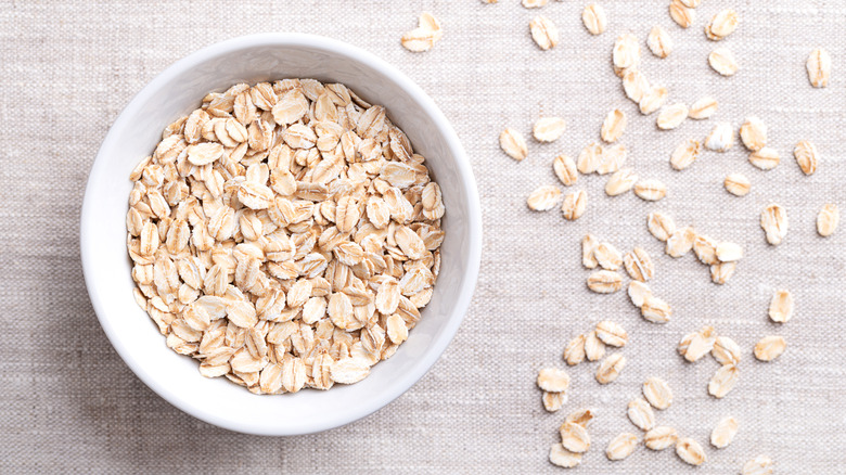 dry rolled oats in a white ceramic bowl