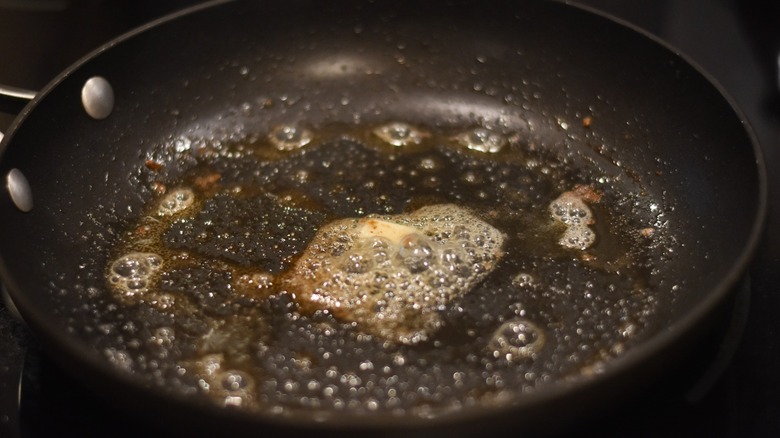 Butter sizzling in a hot skillet