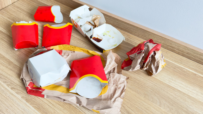 Empty fast food packaging on table