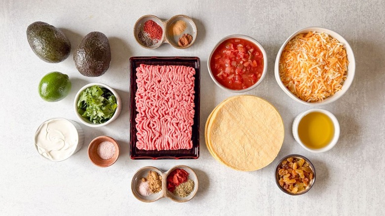 Baked crispy beef tacos ingredients on countertop