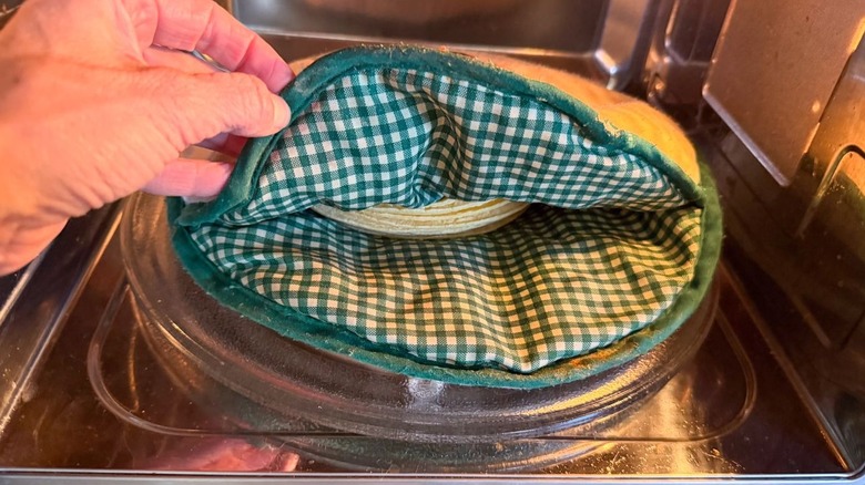 Corn tortillas in tortilla warmer in microwave
