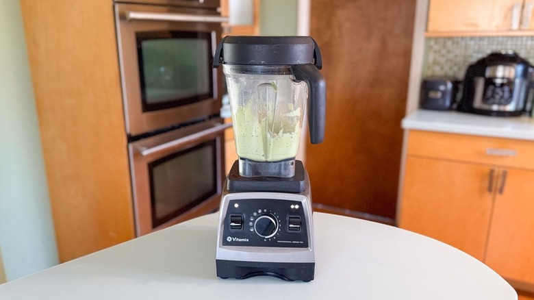 Avocado crema in blender on countertop