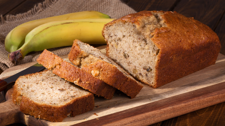 Sliced banana bread on a bread board