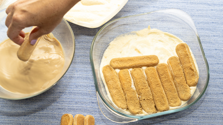 Person's hands preparing ingredients for tiramisu