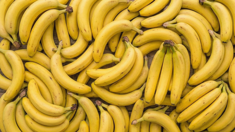 stacks of fresh yellow bananas filling the whole frame.