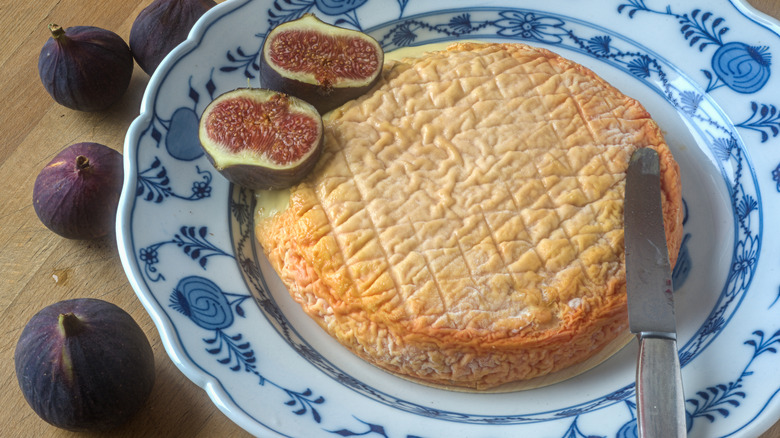 Époisses, French cheese from Burgundy on a plate.
