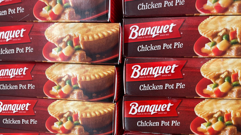 Stacks of boxes of Banquet chicken pot pies at the grocery store.