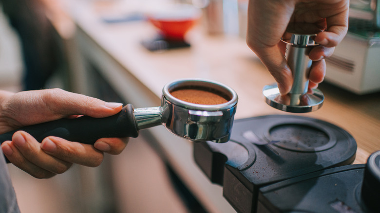 An espresso shot being tamped
